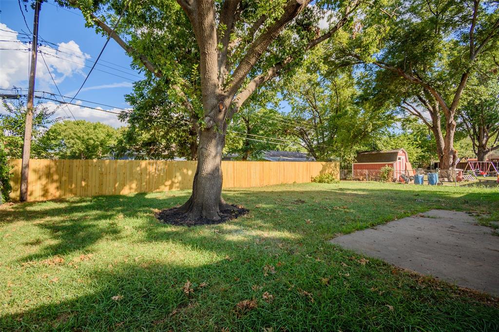 3328 Hedrick Street Fort Worth, TX 76111 - Photo 28 of 28 a view of a yard with a tree