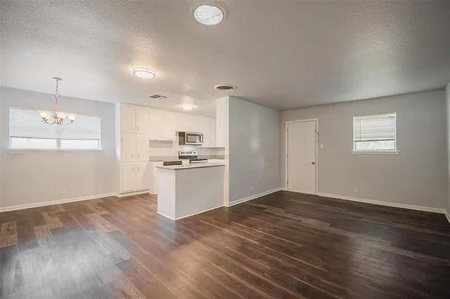 a view of kitchen with wooden floor