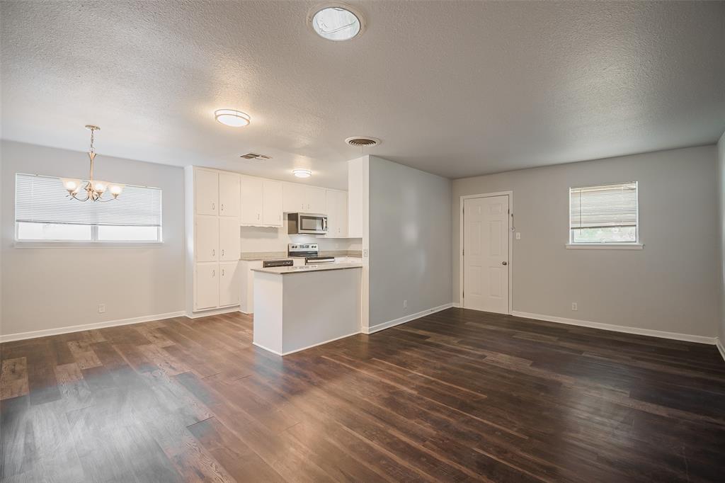 3328 Hedrick Street Fort Worth, TX 76111 - Photo 7 of 28 a view of kitchen with wooden floor