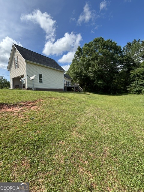 771 Hamilton Road Concord, GA 30206 - Photo 29 of 30 a house view with garden space and trees in the background