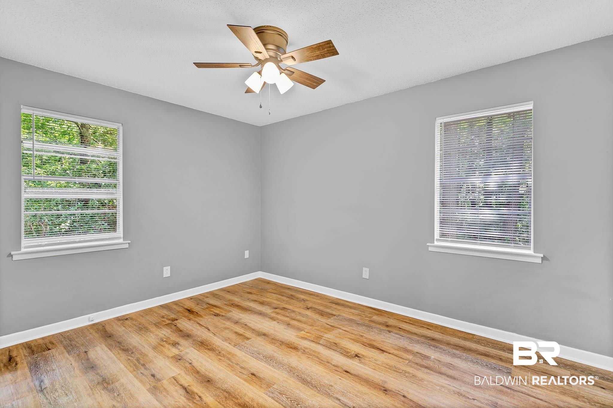 3304 Armond Drive Mobile, AL 36605 - Photo 29 of 62 Empty room with ceiling fan and wood finished floors