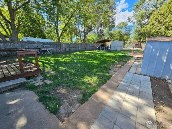 a backyard of a house with outdoor seating