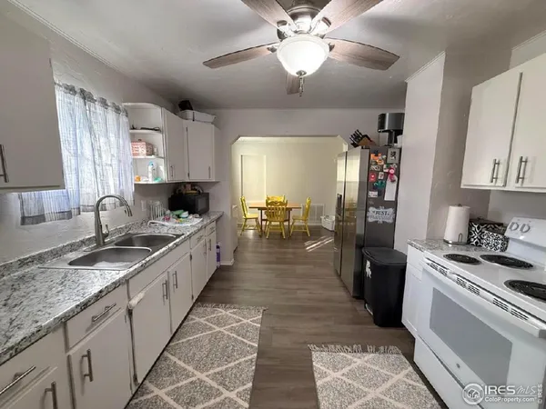 a large kitchen with granite countertop lots of counter top space