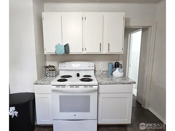 a kitchen with a stove and cabinets