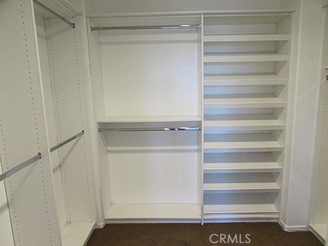 10918 Clover Circle Corona, CA 92883 - Photo 19 of 25 a view of walk in closet with empty racks