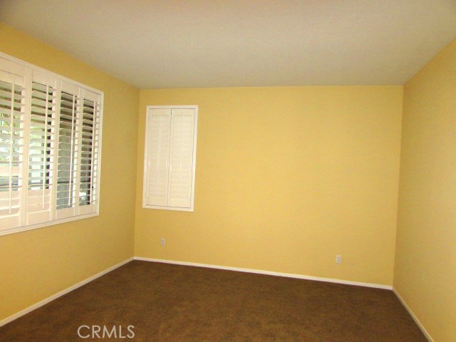 10918 Clover Circle Corona, CA 92883 - Photo 2 of 25 a view of an empty room with a window