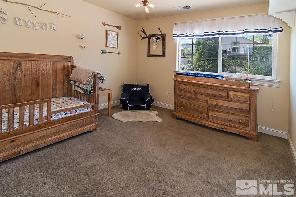 6120 Clover Meadows Court Reno, NV 89519 - Photo 18 of 21 a bedroom with furniture and a window