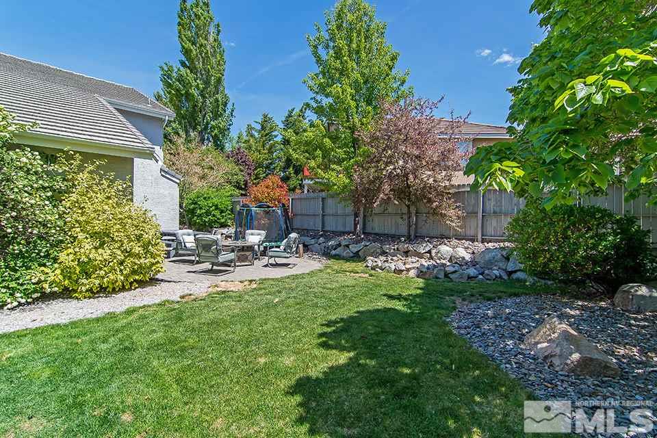 6120 Clover Meadows Court Reno, NV 89519 - Photo 21 of 21 a view of a chair and table in backyard of the house