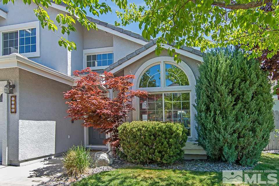 6120 Clover Meadows Court Reno, NV 89519 - Photo 3 of 21 a front view of a house with garden