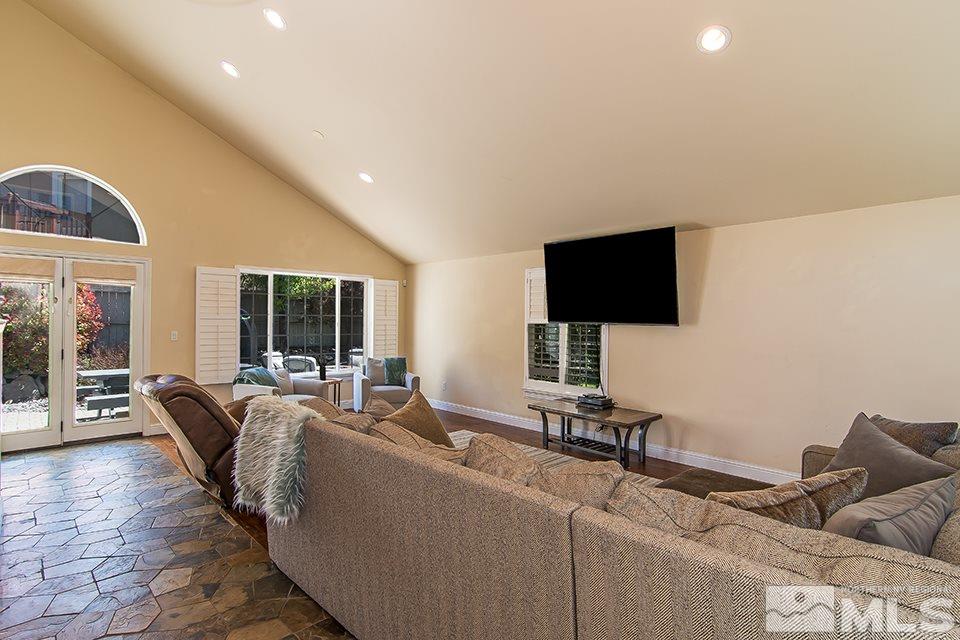 6120 Clover Meadows Court Reno, NV 89519 - Photo 4 of 21 a living room with furniture and a flat screen tv