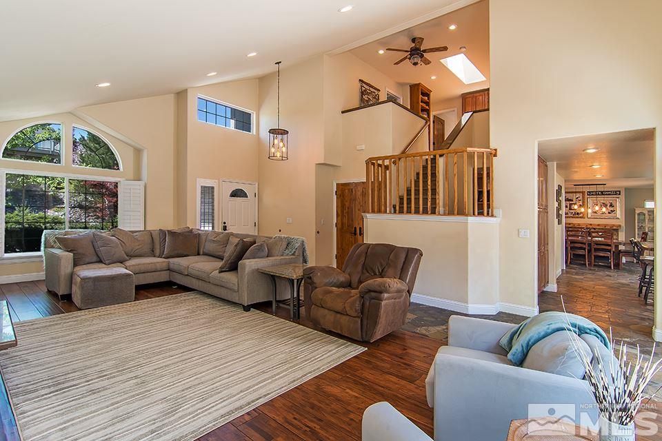 6120 Clover Meadows Court Reno, NV 89519 - Photo 6 of 21 a living room with furniture a large window and wooden floor