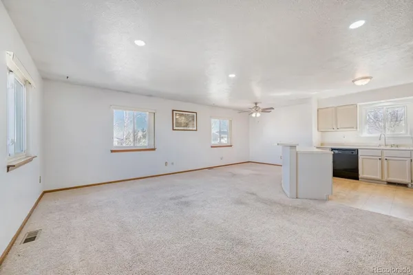 a view of a kitchen with a sink cabinets and a window