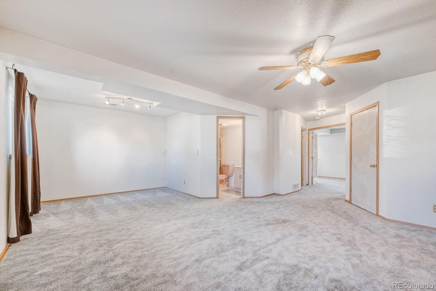 430 Elizabeth Street Fort Lupton, CO 80621 - Photo 10 of 30 a view of an empty room with a window