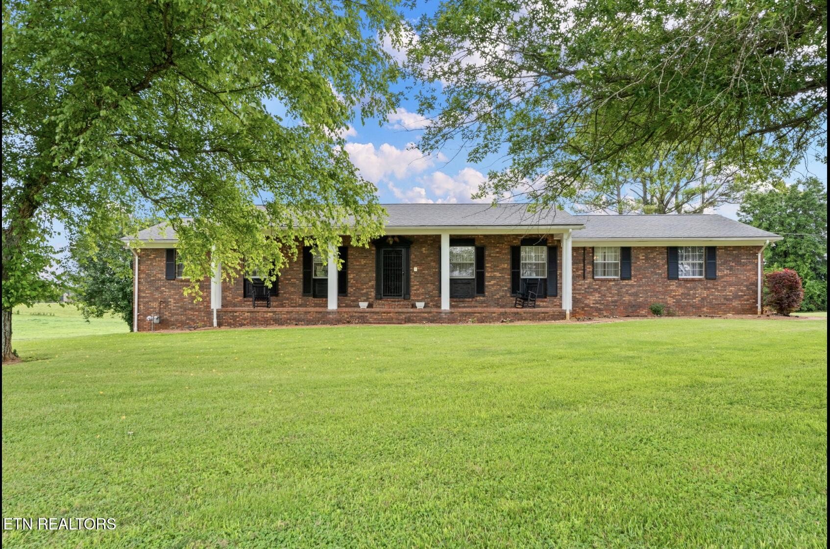571 Calhoun Drive Greenback, TN 37742 - Photo 1 of 44 a view of a house with a backyard