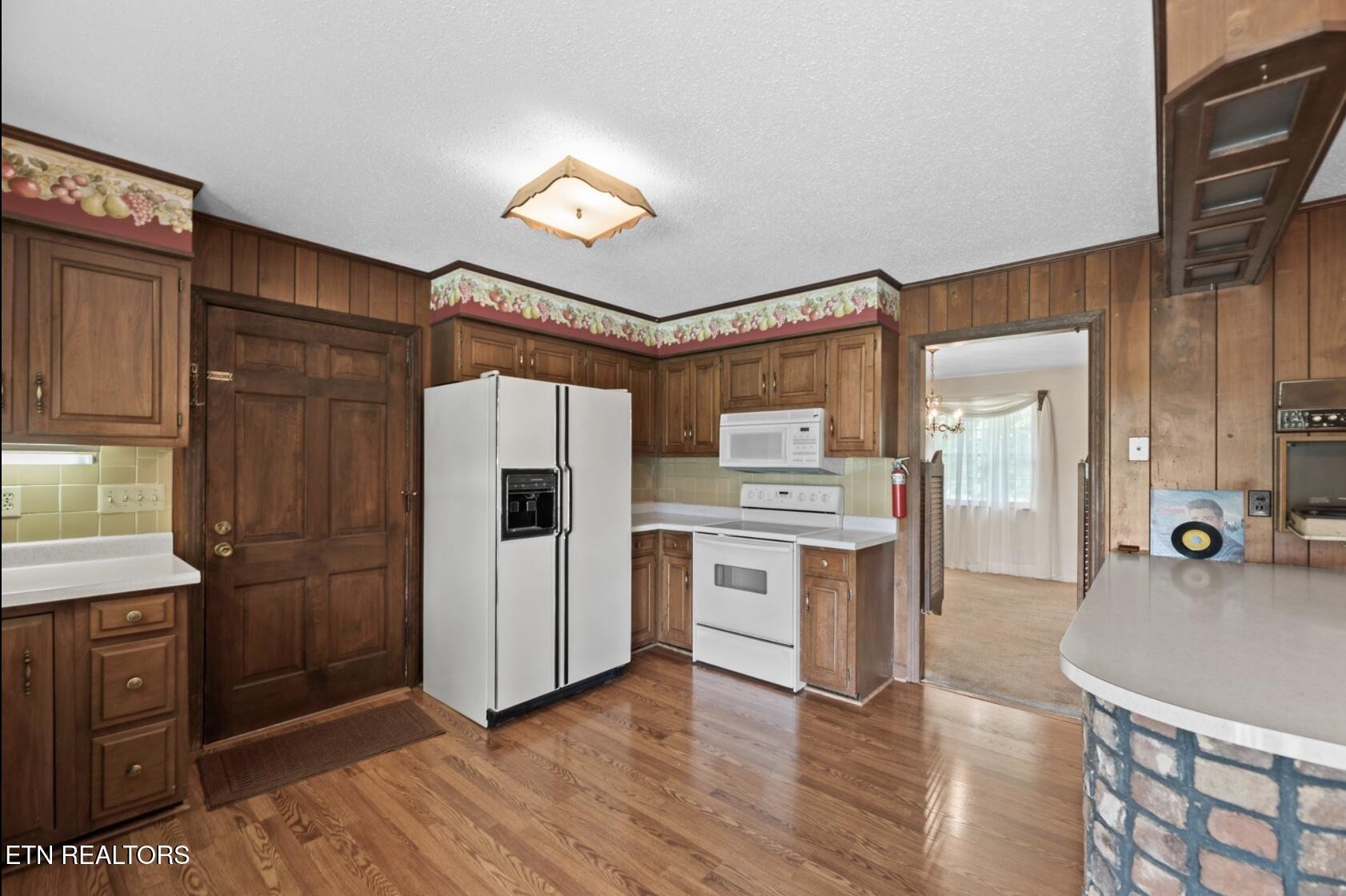 571 Calhoun Drive Greenback, TN 37742 - Photo 18 of 44 a kitchen with stainless steel appliances granite countertop a refrigerator and a stove top oven