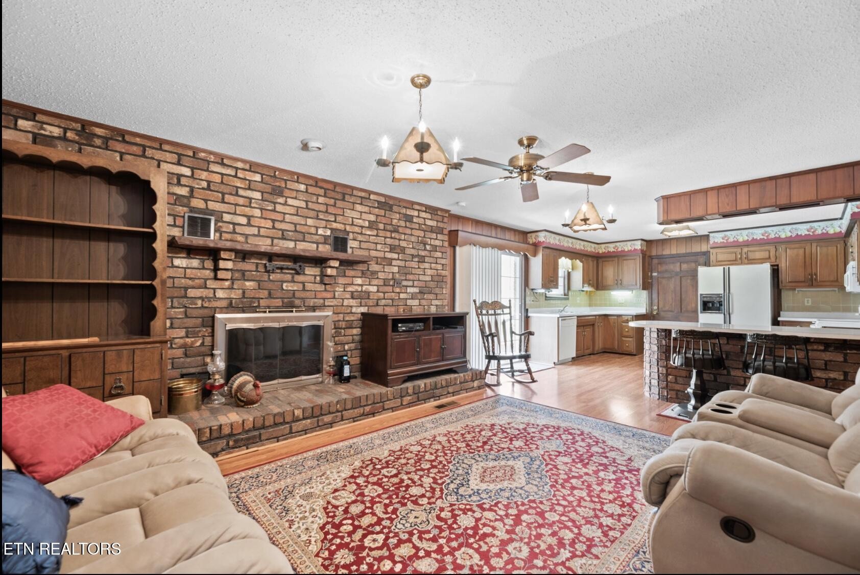 571 Calhoun Drive Greenback, TN 37742 - Photo 23 of 44 a living room with furniture a fireplace and a table