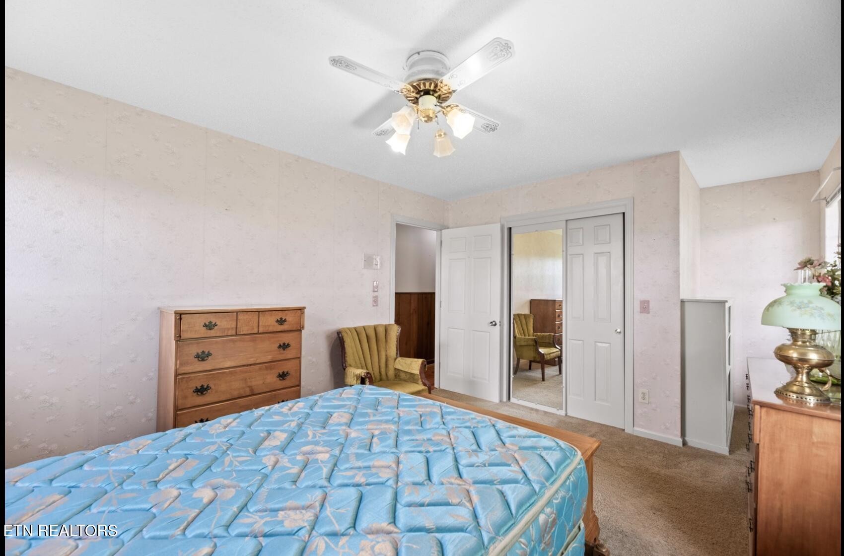 571 Calhoun Drive Greenback, TN 37742 - Photo 33 of 44 a bedroom with a bed and a dresser