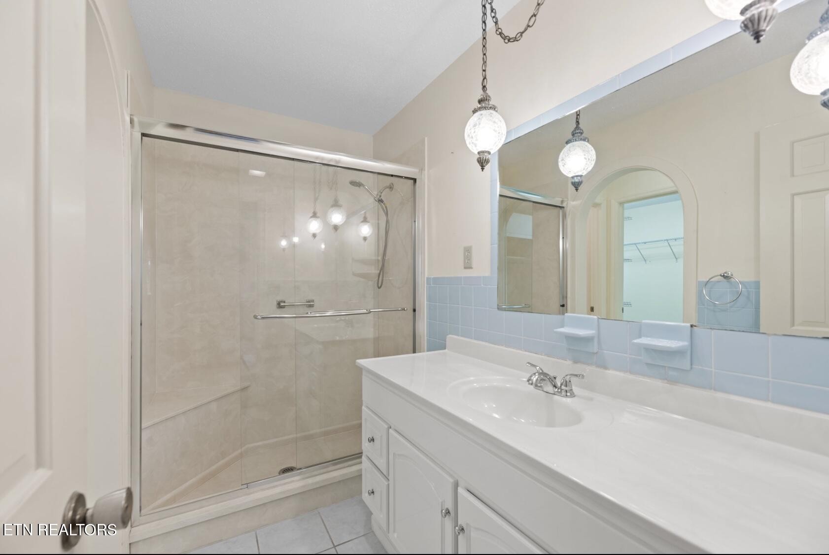 571 Calhoun Drive Greenback, TN 37742 - Photo 35 of 44 a bathroom with a shower sink and mirror