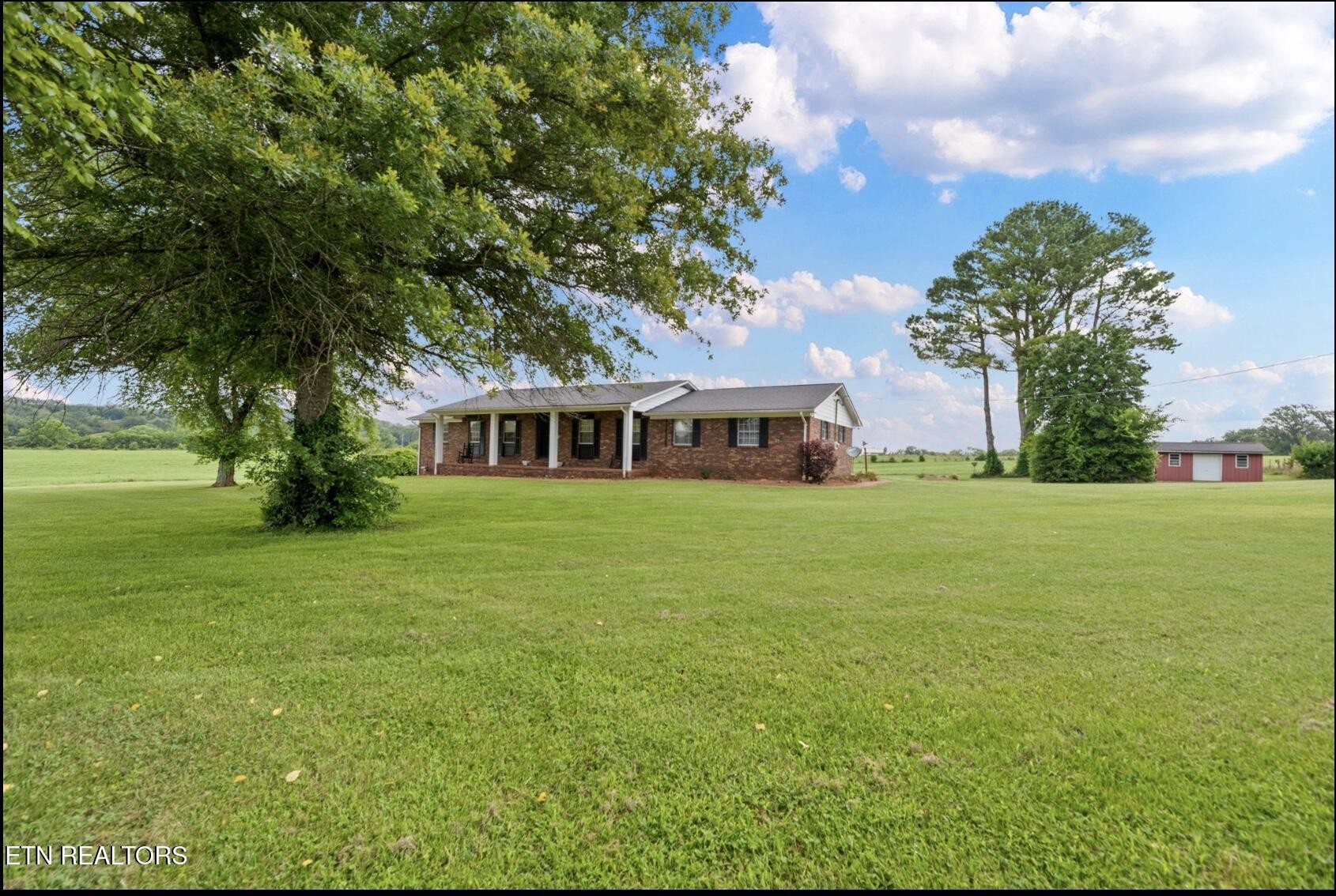 571 Calhoun Drive Greenback, TN 37742 - Photo 4 of 44 a front view of house with yard and trees