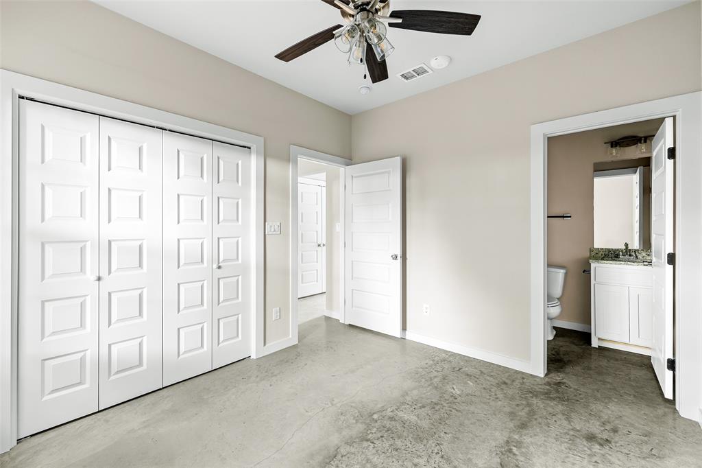 2290 West Tarleton Street, Unit 105 Stephenville, TX 76401 - Photo 12 of 15 a view of an empty room with a ceiling fan