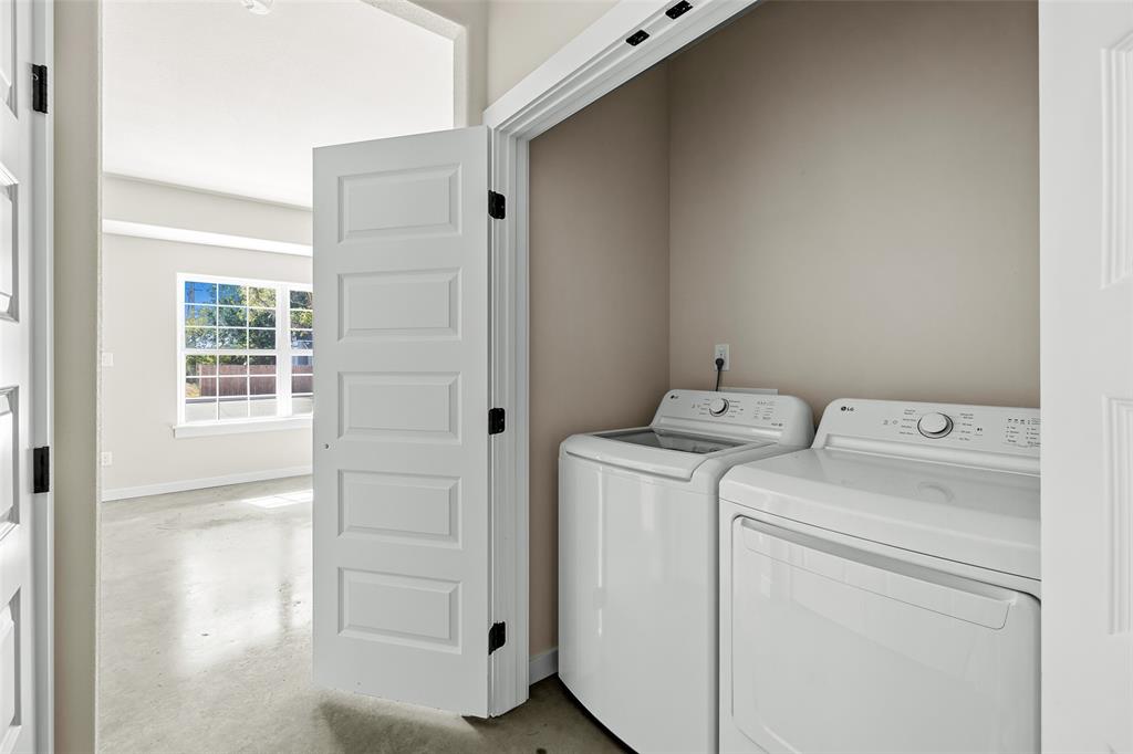 2290 West Tarleton Street, Unit 105 Stephenville, TX 76401 - Photo 8 of 15 a utility room with dryer and washer