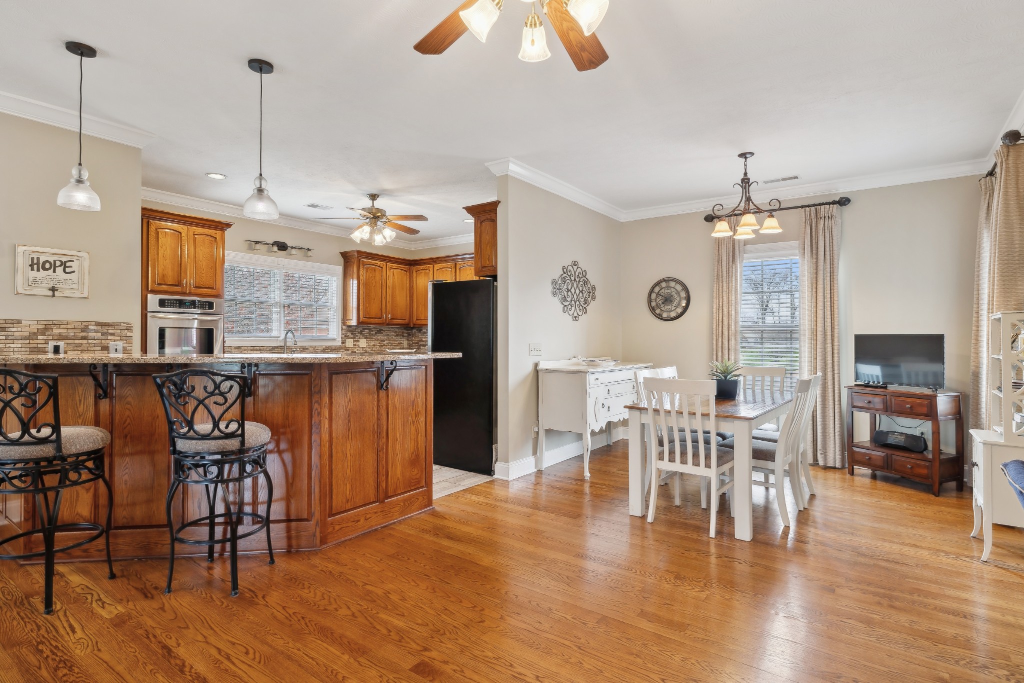 2108 Rodman Boulevard Gallatin, TN 37066 - Photo 11 of 45 a view of a dining room with furniture window and wooden floor