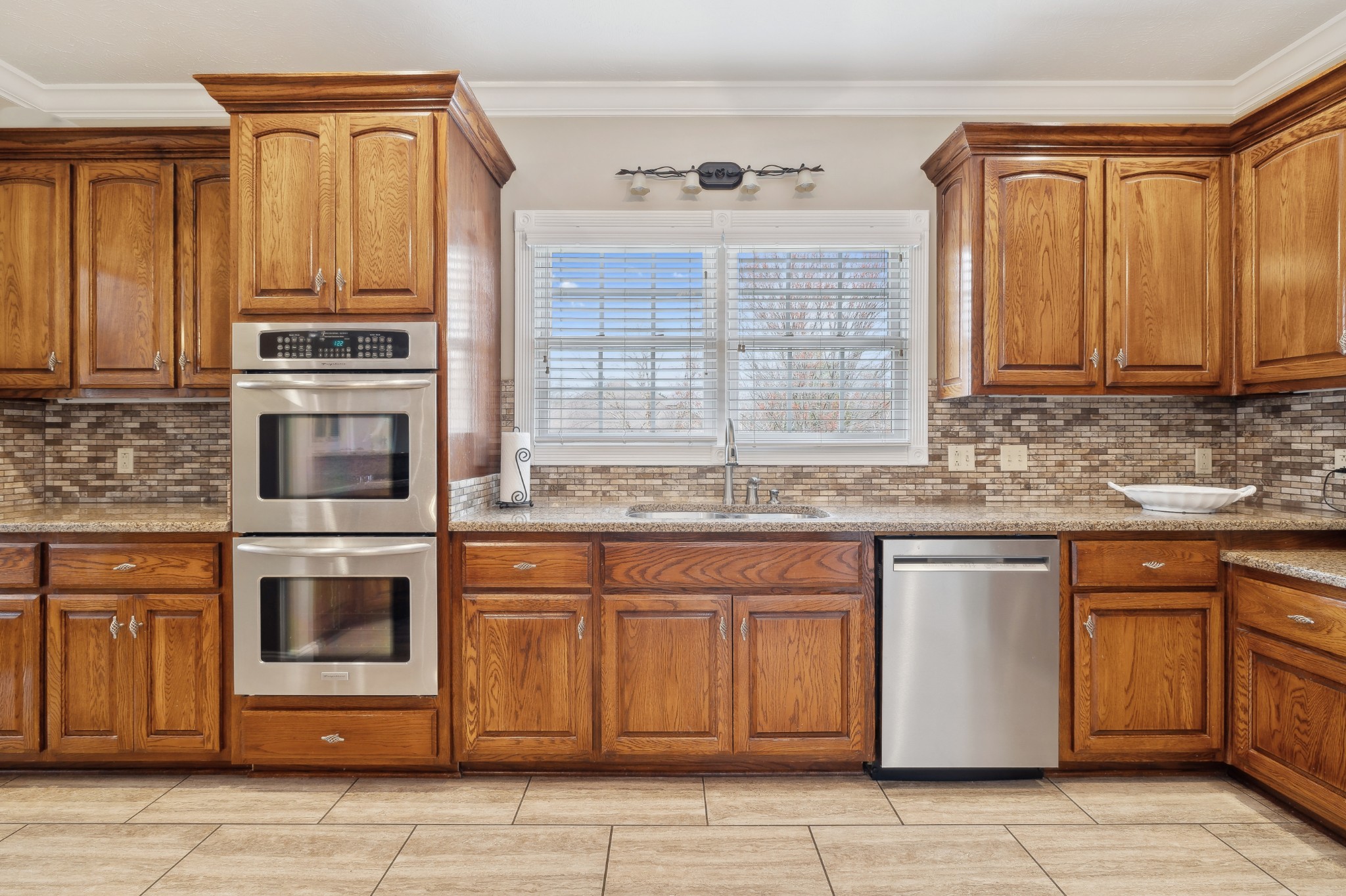2108 Rodman Boulevard Gallatin, TN 37066 - Photo 12 of 45 a kitchen with granite countertop a stove top oven