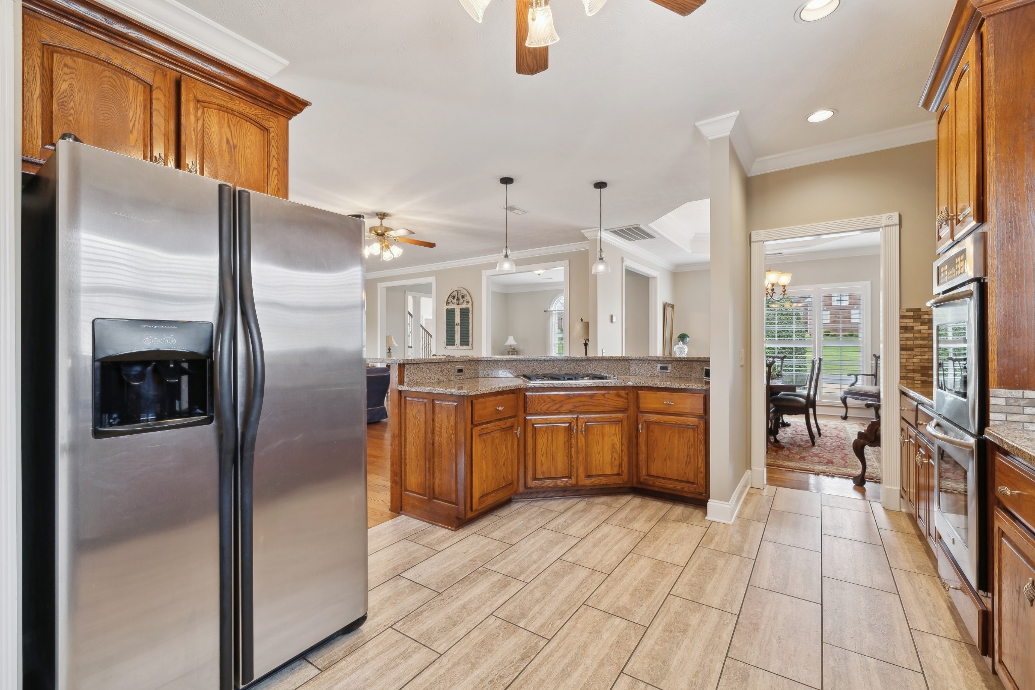 2108 Rodman Boulevard Gallatin, TN 37066 - Photo 13 of 45 a large kitchen with a large counter top a sink stainless steel appliances and cabinets