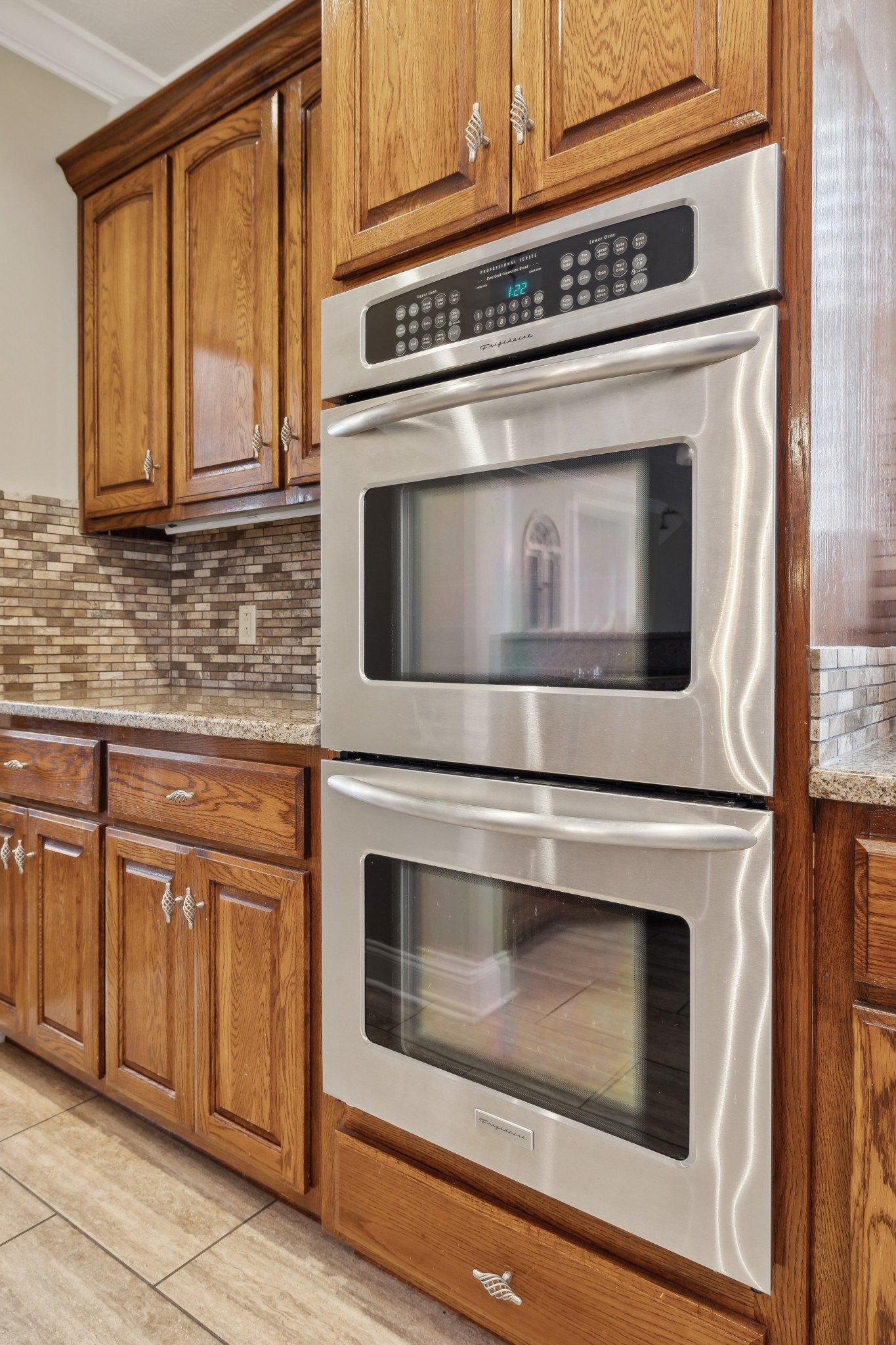 2108 Rodman Boulevard Gallatin, TN 37066 - Photo 14 of 45 a kitchen with granite countertop white cabinets stainless steel appliances and white appliances