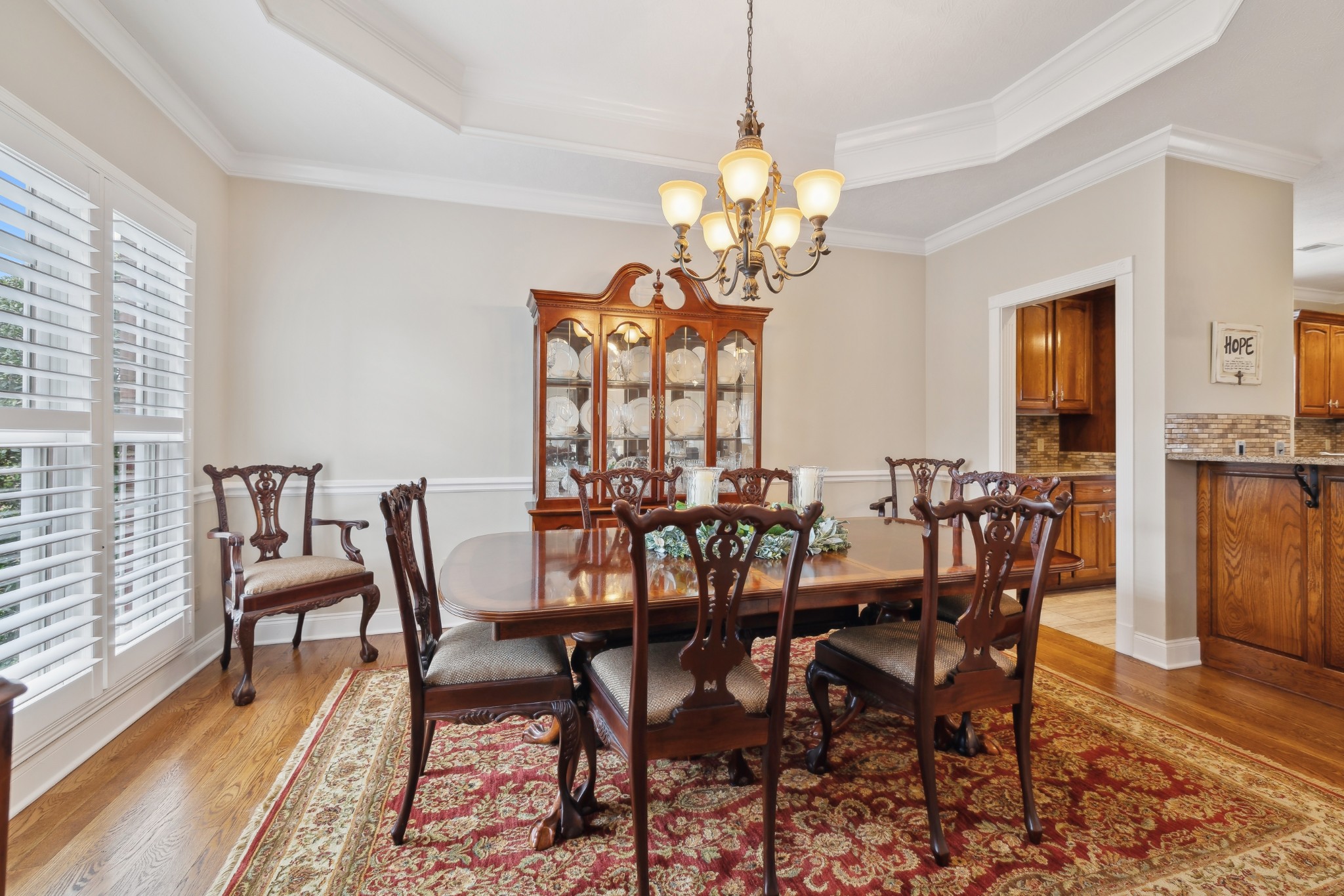 2108 Rodman Boulevard Gallatin, TN 37066 - Photo 18 of 45 a view of a dining room with furniture wooden floor and chandelier