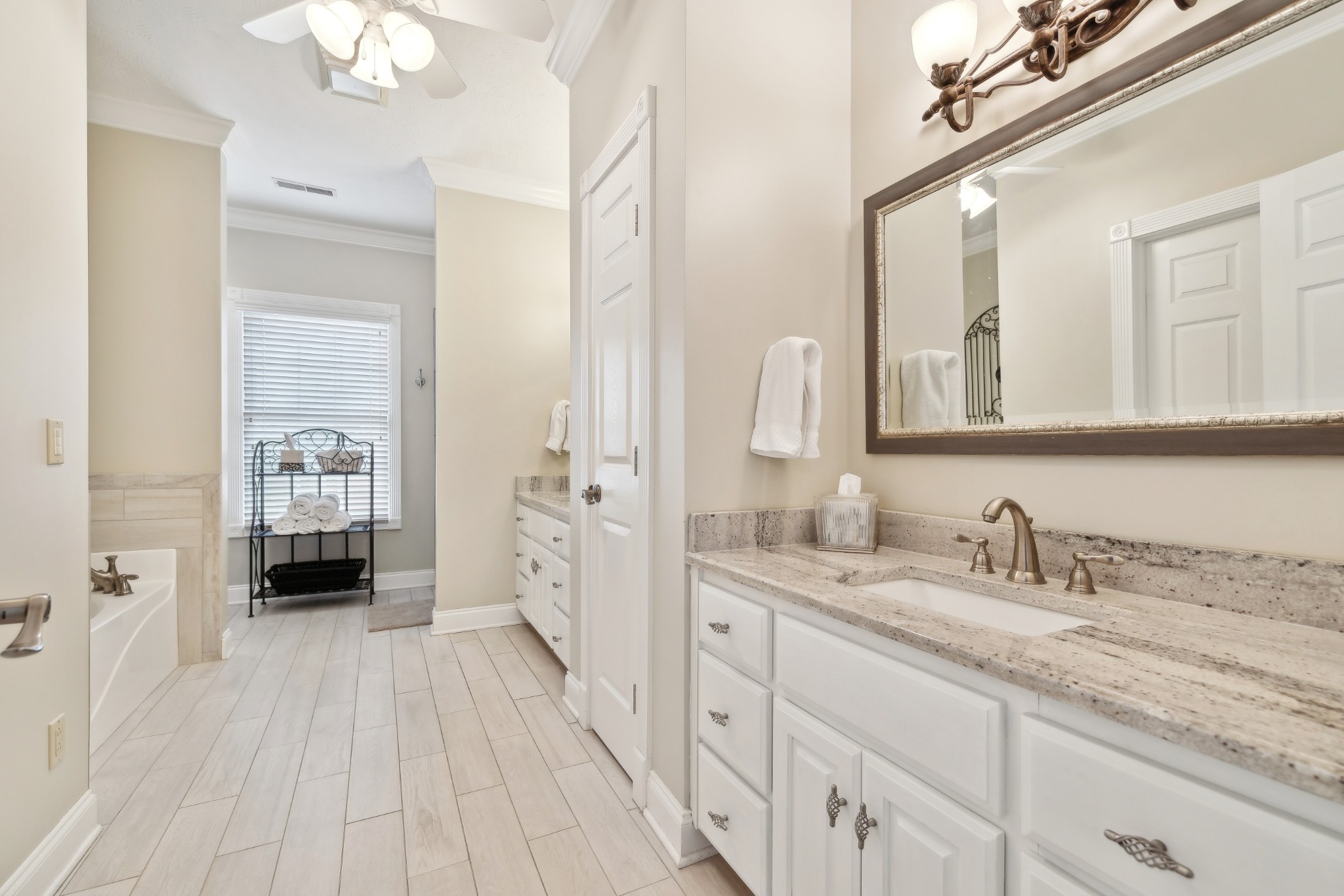 2108 Rodman Boulevard Gallatin, TN 37066 - Photo 21 of 45 a en suite bathroom with a double vanity sink and mirror