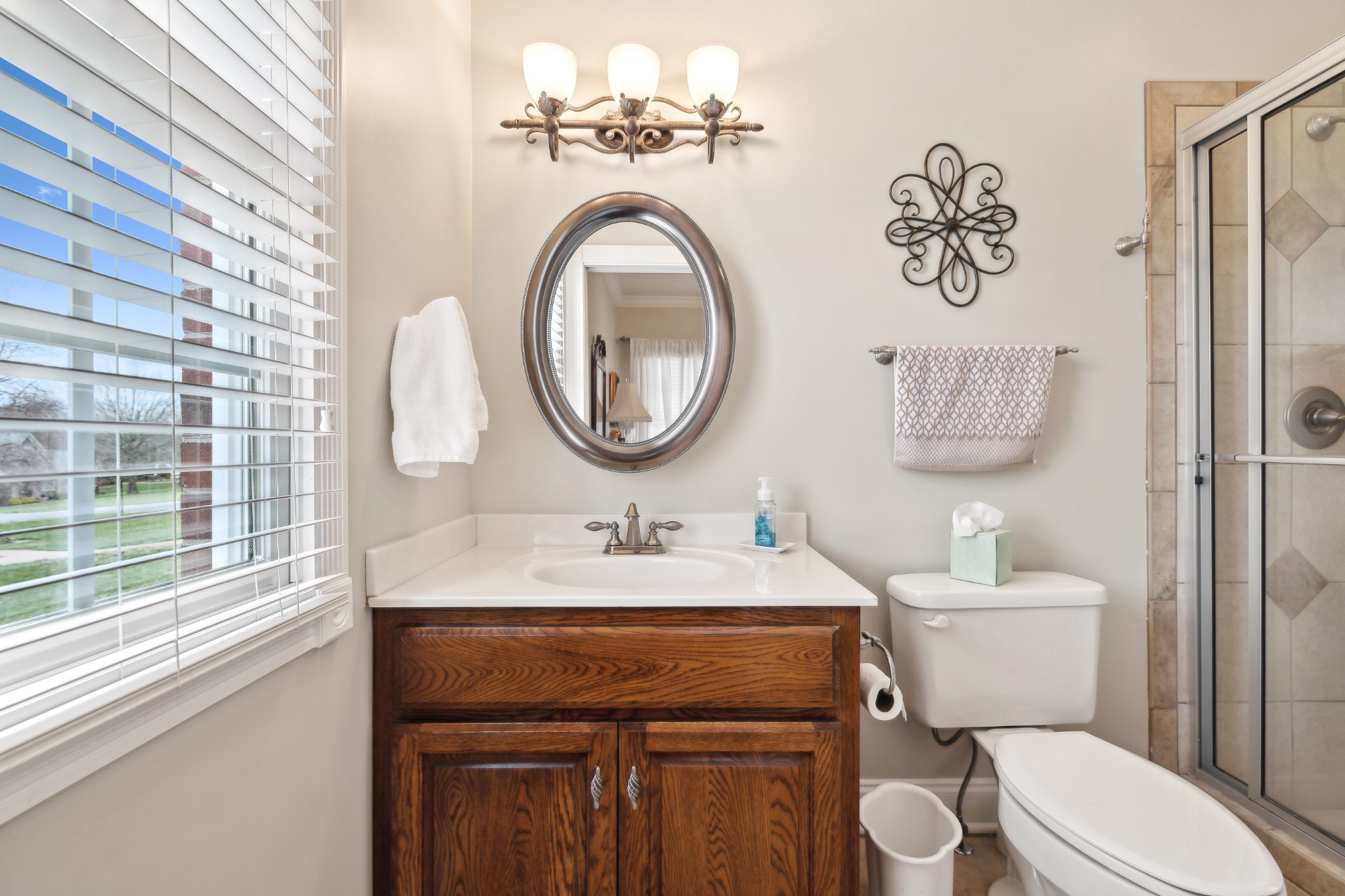 2108 Rodman Boulevard Gallatin, TN 37066 - Photo 26 of 45 a bathroom with a toilet a sink and a mirror