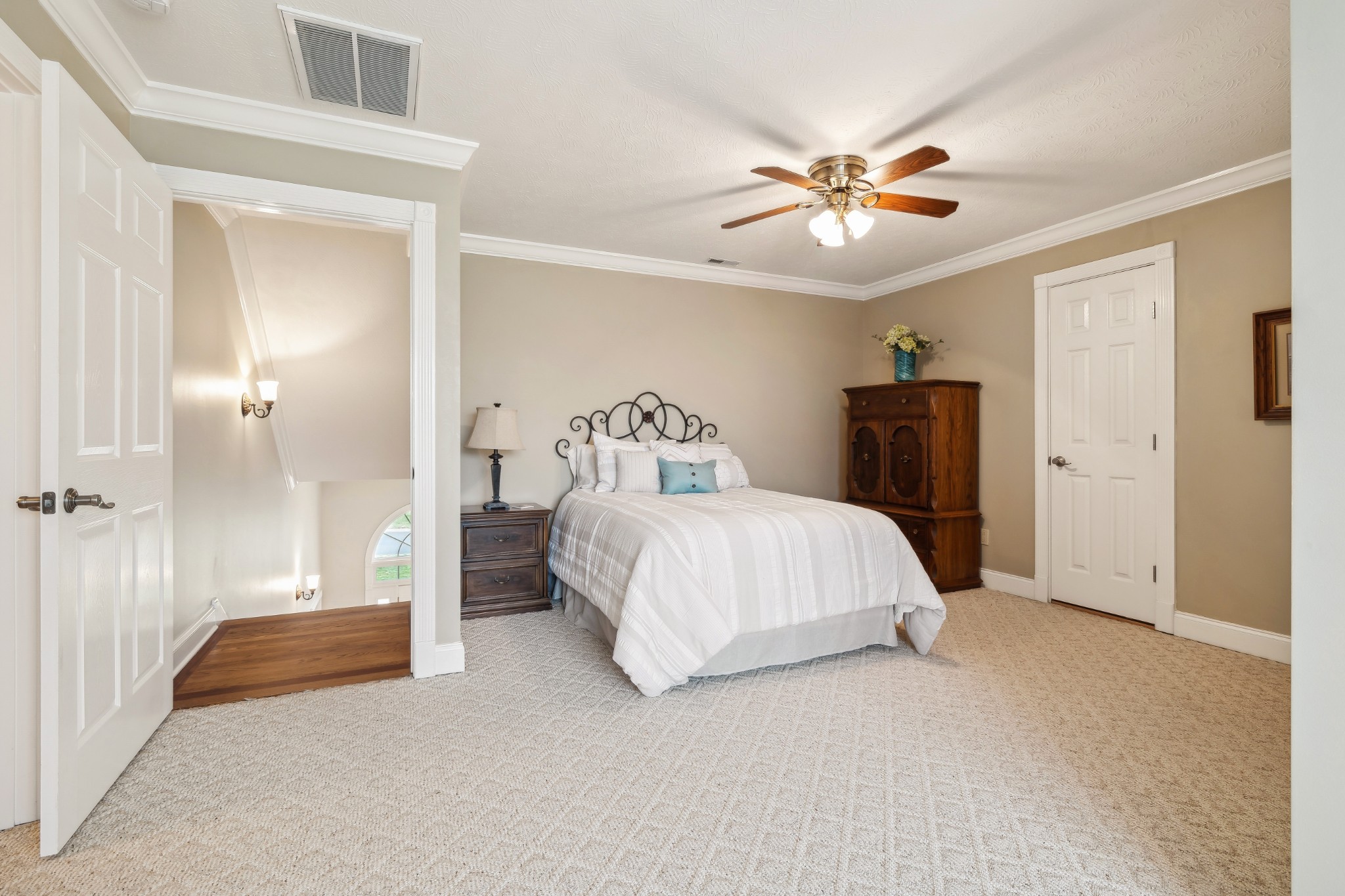 2108 Rodman Boulevard Gallatin, TN 37066 - Photo 31 of 45 a bedroom with a large bed and a chandelier