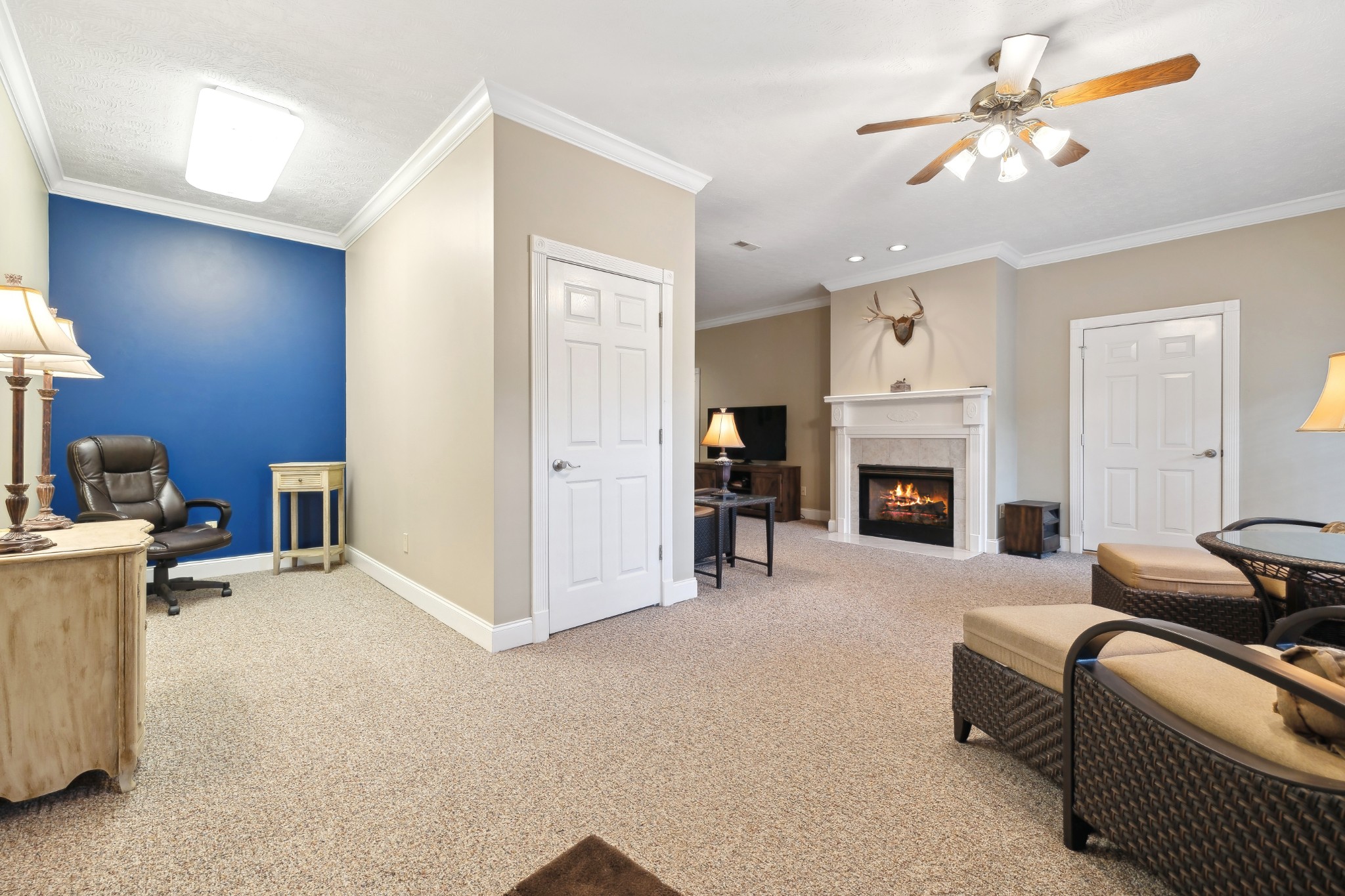 2108 Rodman Boulevard Gallatin, TN 37066 - Photo 36 of 45 a living room with furniture a fireplace and a chandelier