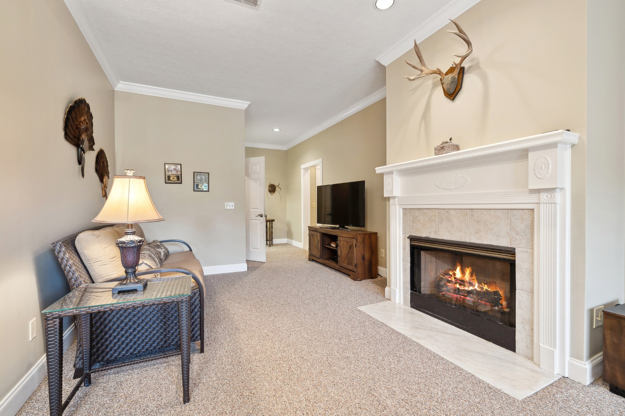2108 Rodman Boulevard Gallatin, TN 37066 - Photo 37 of 45 a living room with furniture a fireplace and a flat screen tv