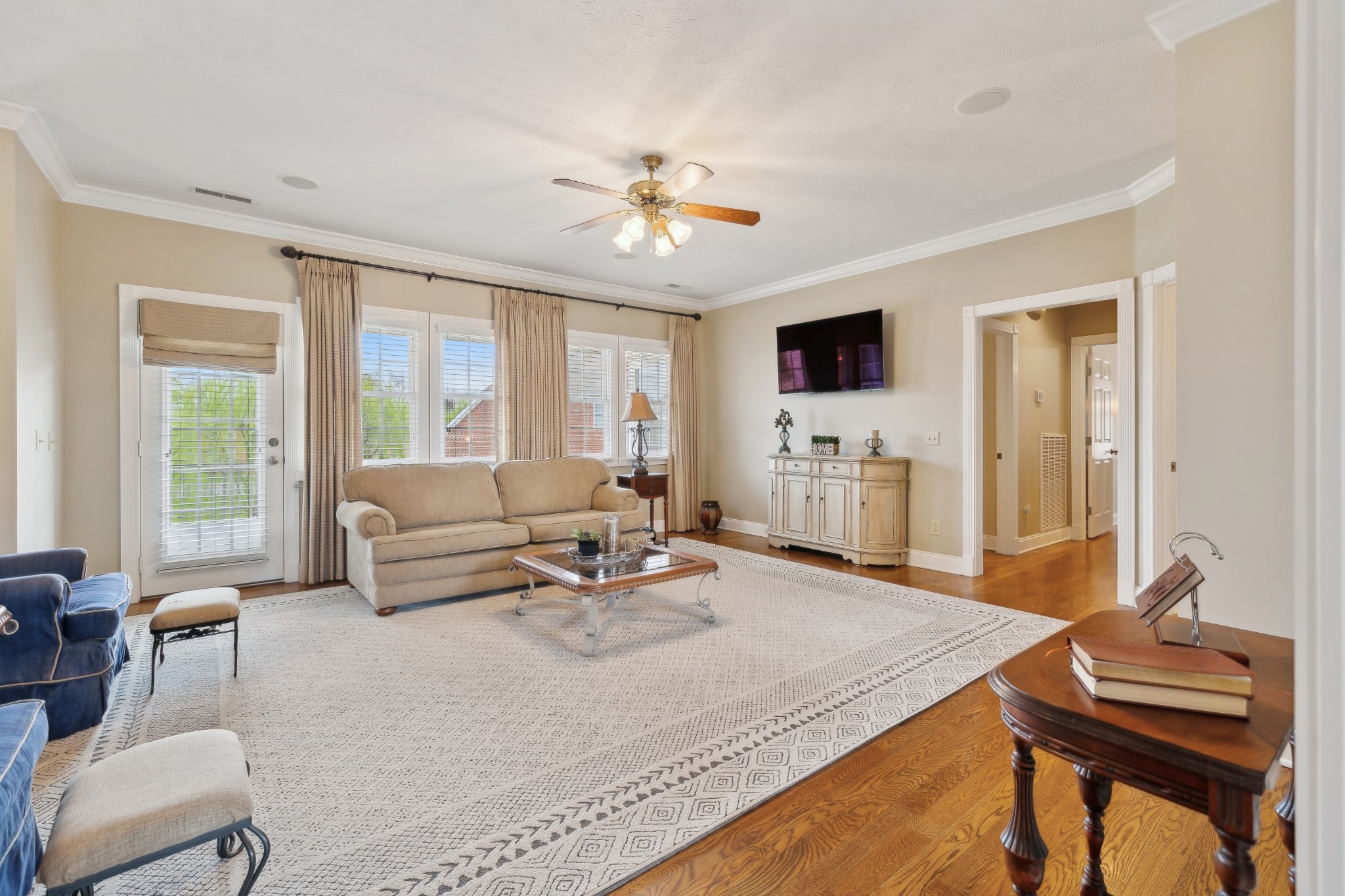 2108 Rodman Boulevard Gallatin, TN 37066 - Photo 6 of 45 a living room with furniture a flat screen tv and a large window
