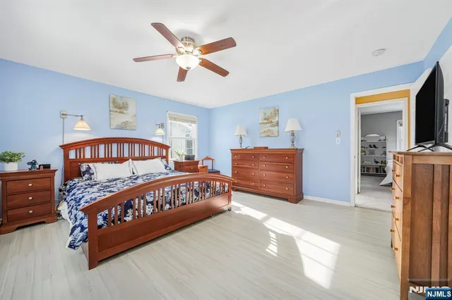 a bedroom with a bed and closet