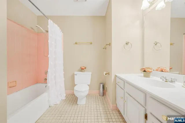 a bathroom with a sink toilet a shower and a bathtub