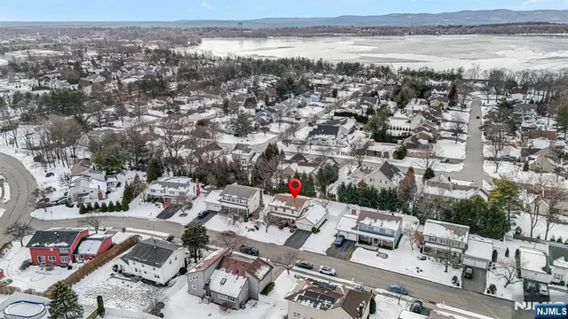 a view of dirt road with a building in the background