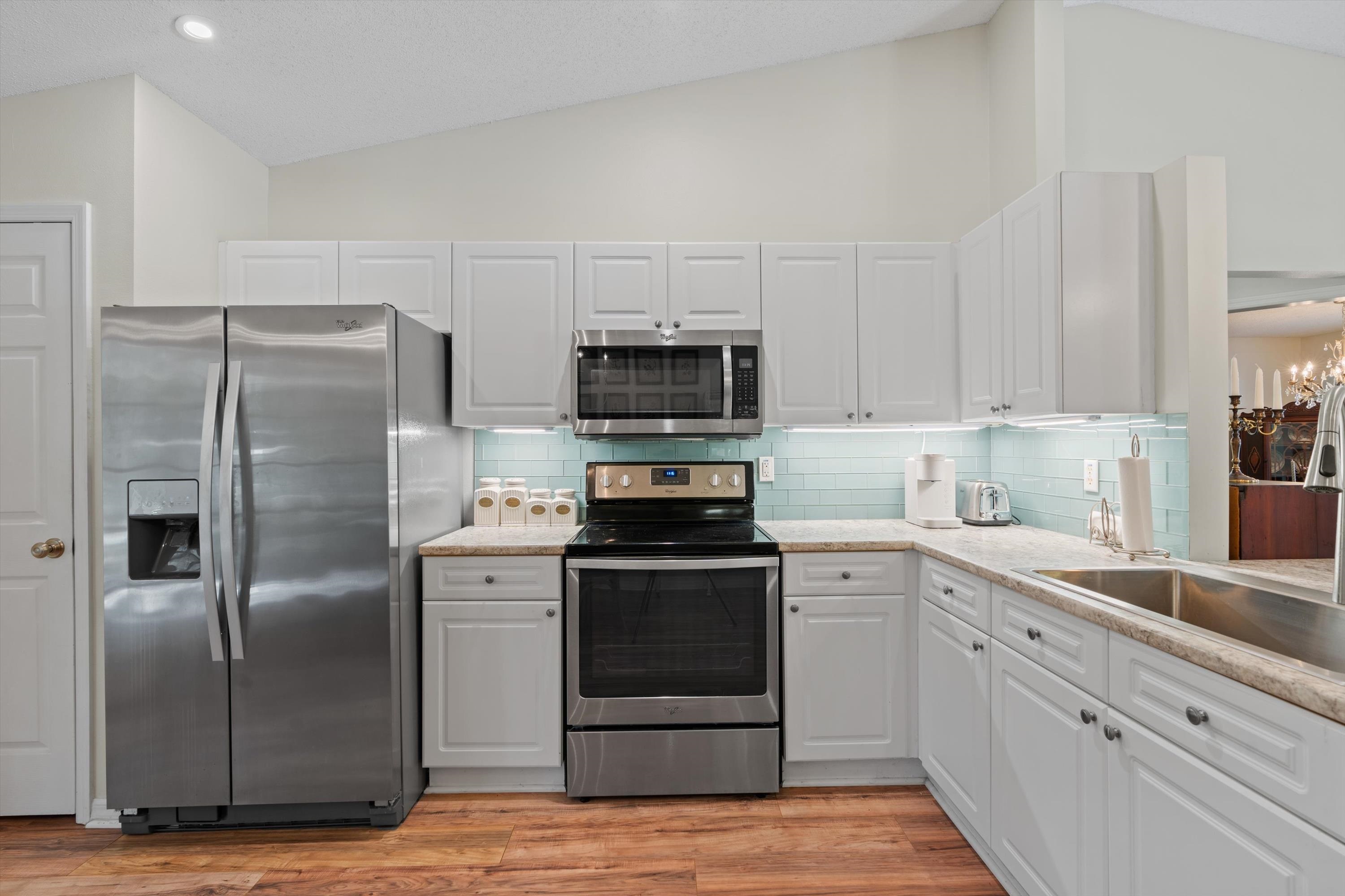 222 Bonita Road St. Augustine, FL 32086 - Photo 12 of 46 a kitchen with cabinets stainless steel appliances and a counter space