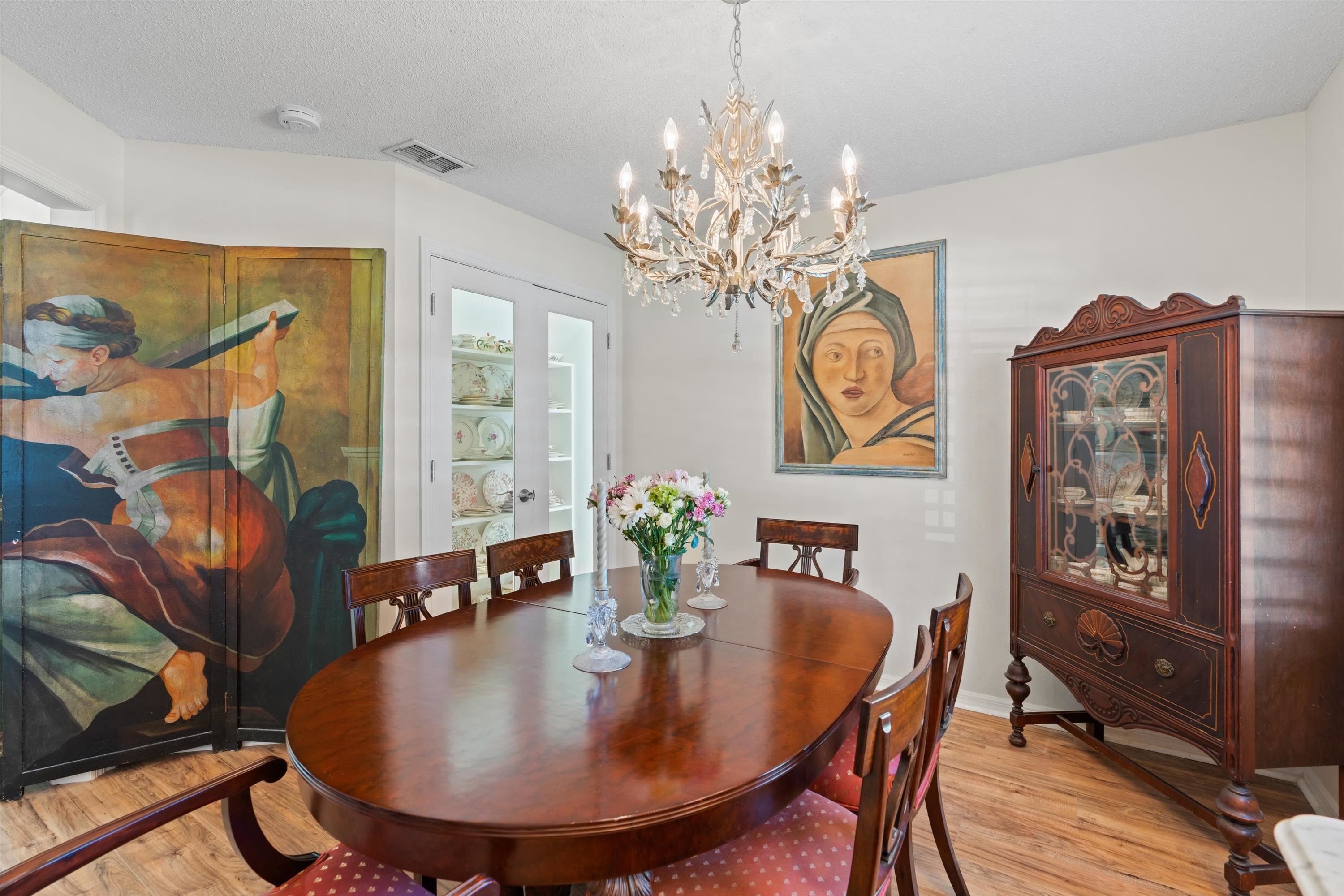 222 Bonita Road St. Augustine, FL 32086 - Photo 19 of 46 a dining room with furniture and chandelier