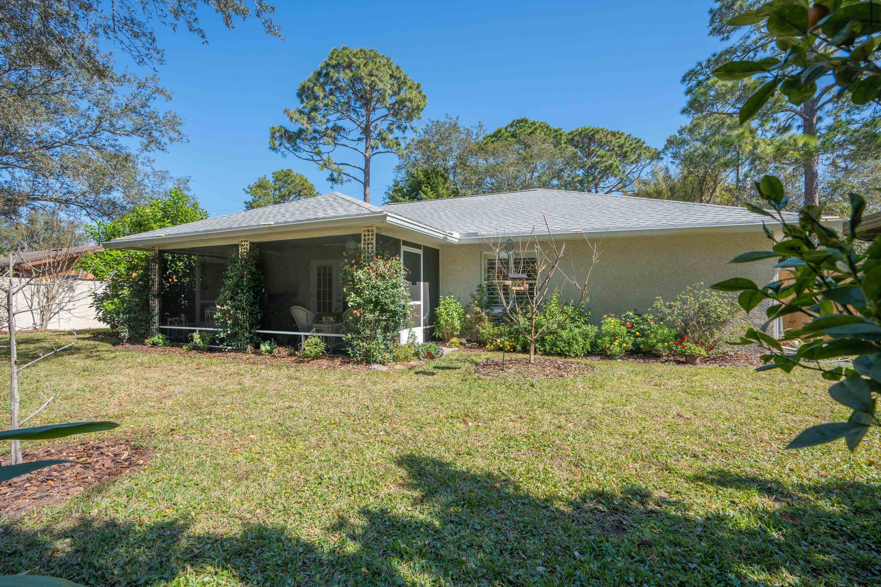 222 Bonita Road St. Augustine, FL 32086 - Photo 30 of 46 a view of a house with backyard porch and garden