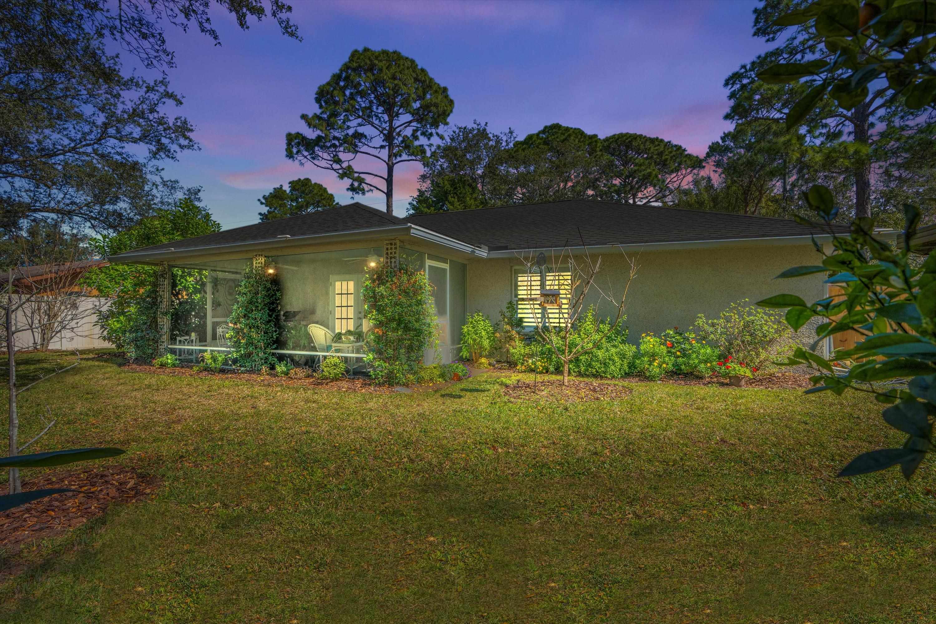 222 Bonita Road St. Augustine, FL 32086 - Photo 31 of 46 a front view of a house with garden