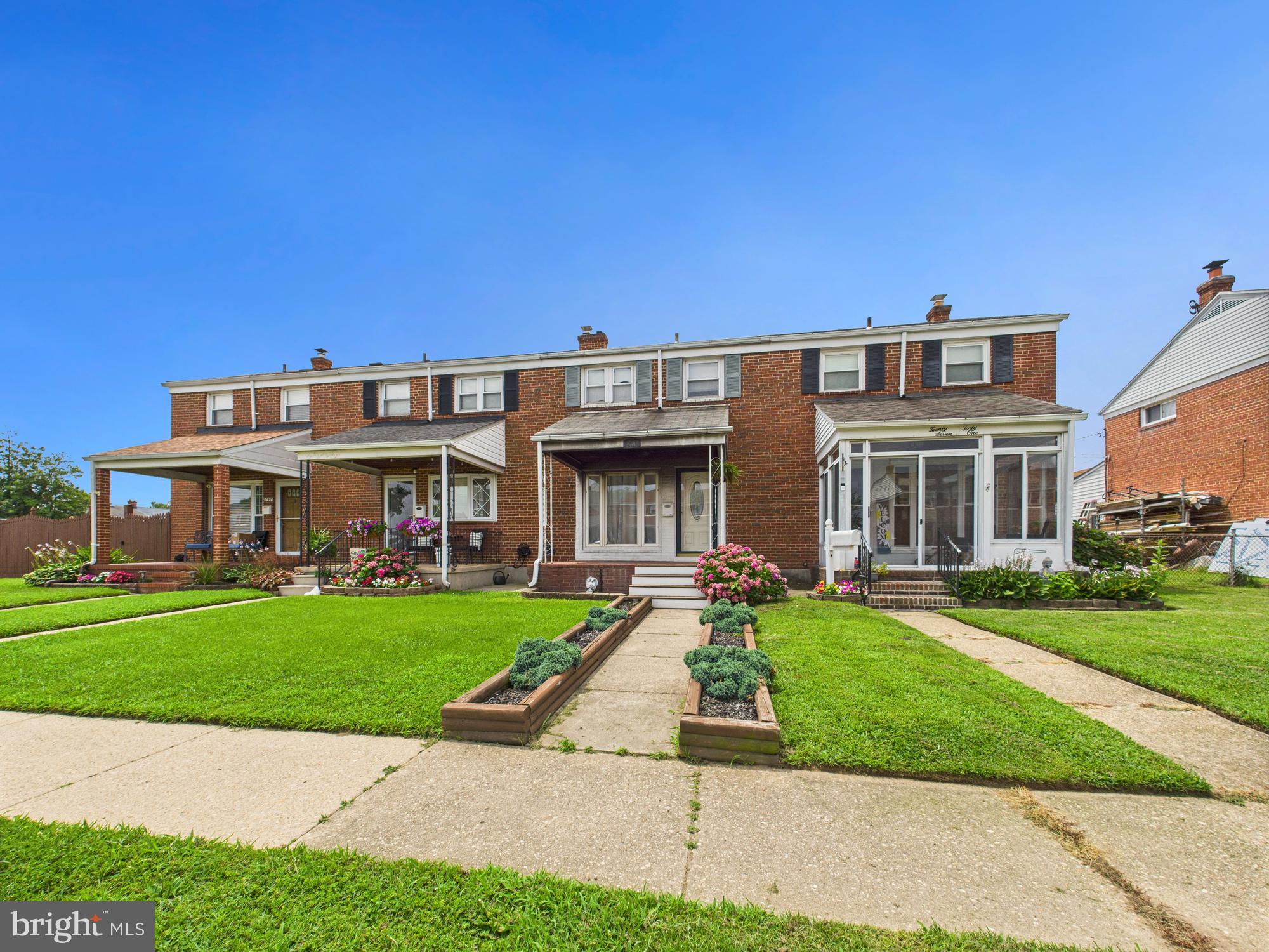 a front view of a house with a yard table and chairs