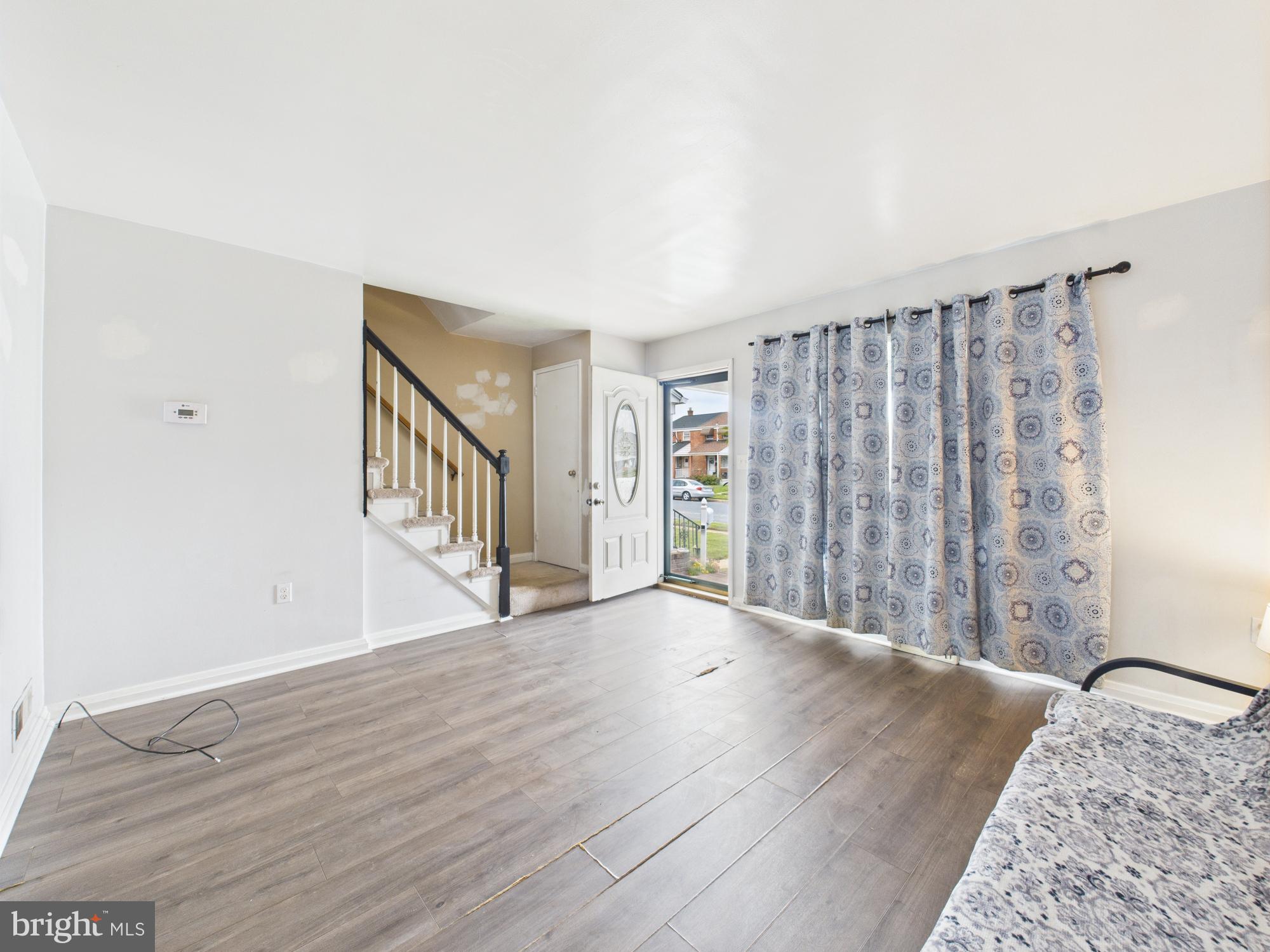 2743 Kirkleigh Road Dundalk, MD 21222 - Photo 11 of 31 a view of an empty room with wooden floor