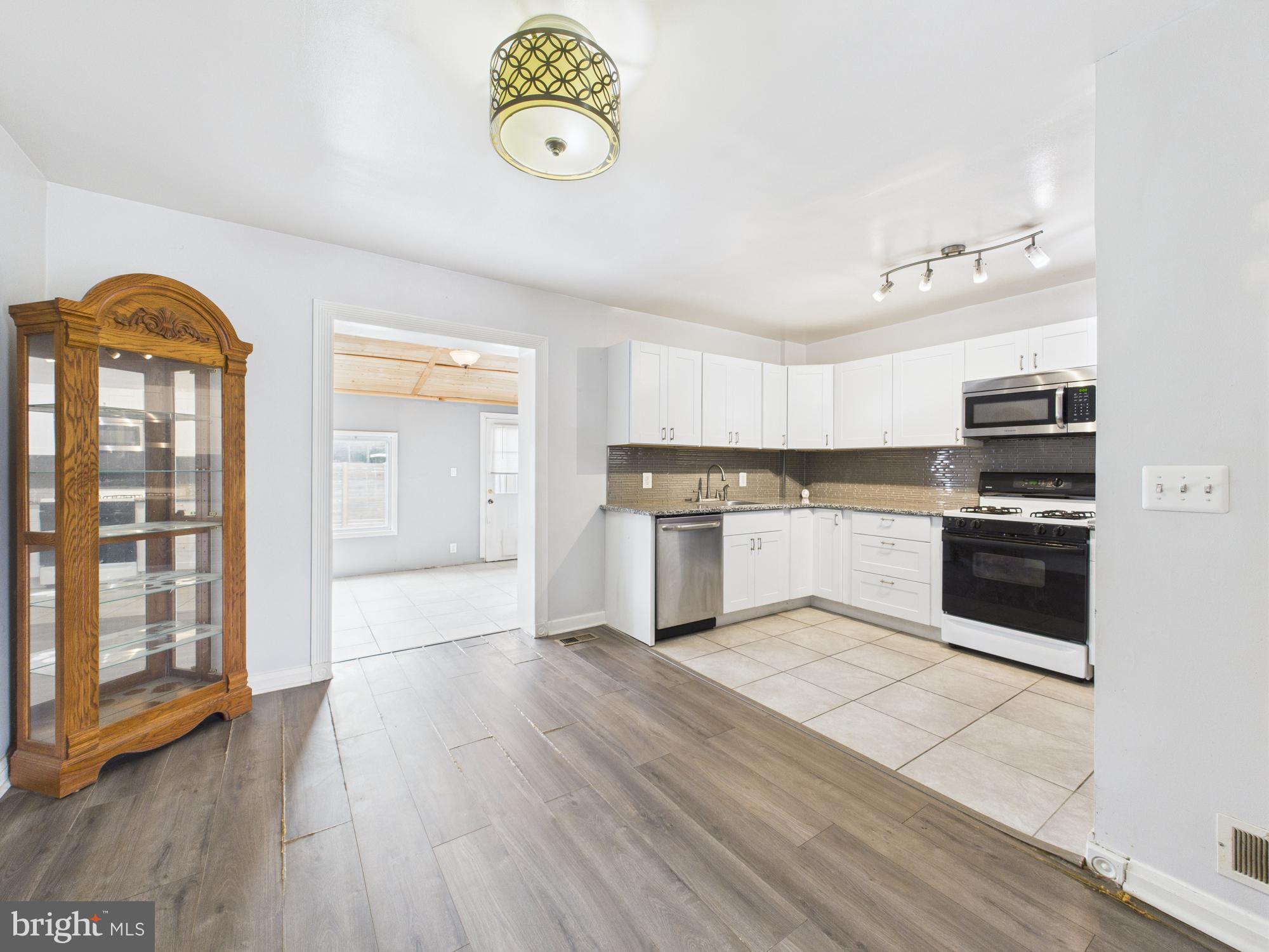 2743 Kirkleigh Road Dundalk, MD 21222 - Photo 14 of 31 a view of kitchen with wooden floor and electronic appliances