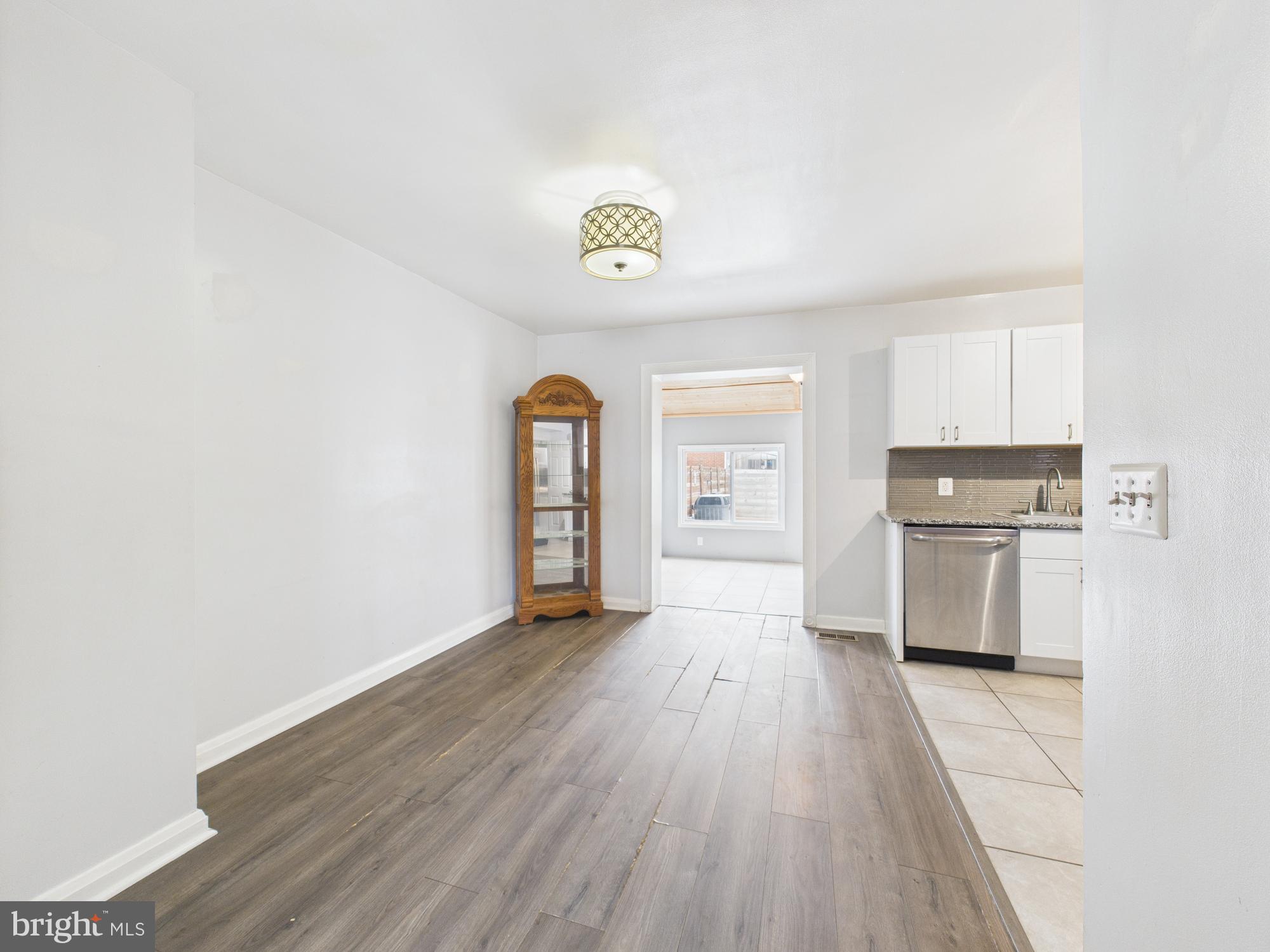2743 Kirkleigh Road Dundalk, MD 21222 - Photo 15 of 31 a view of a kitchen with wooden floor and electronic appliances