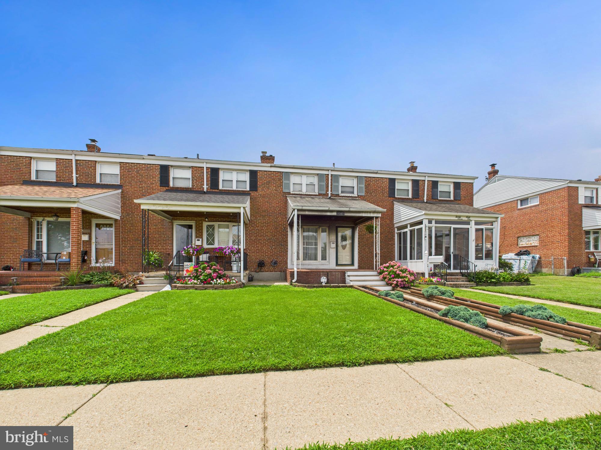 2743 Kirkleigh Road Dundalk, MD 21222 - Photo 20 of 31 front view of a brick building with a yard