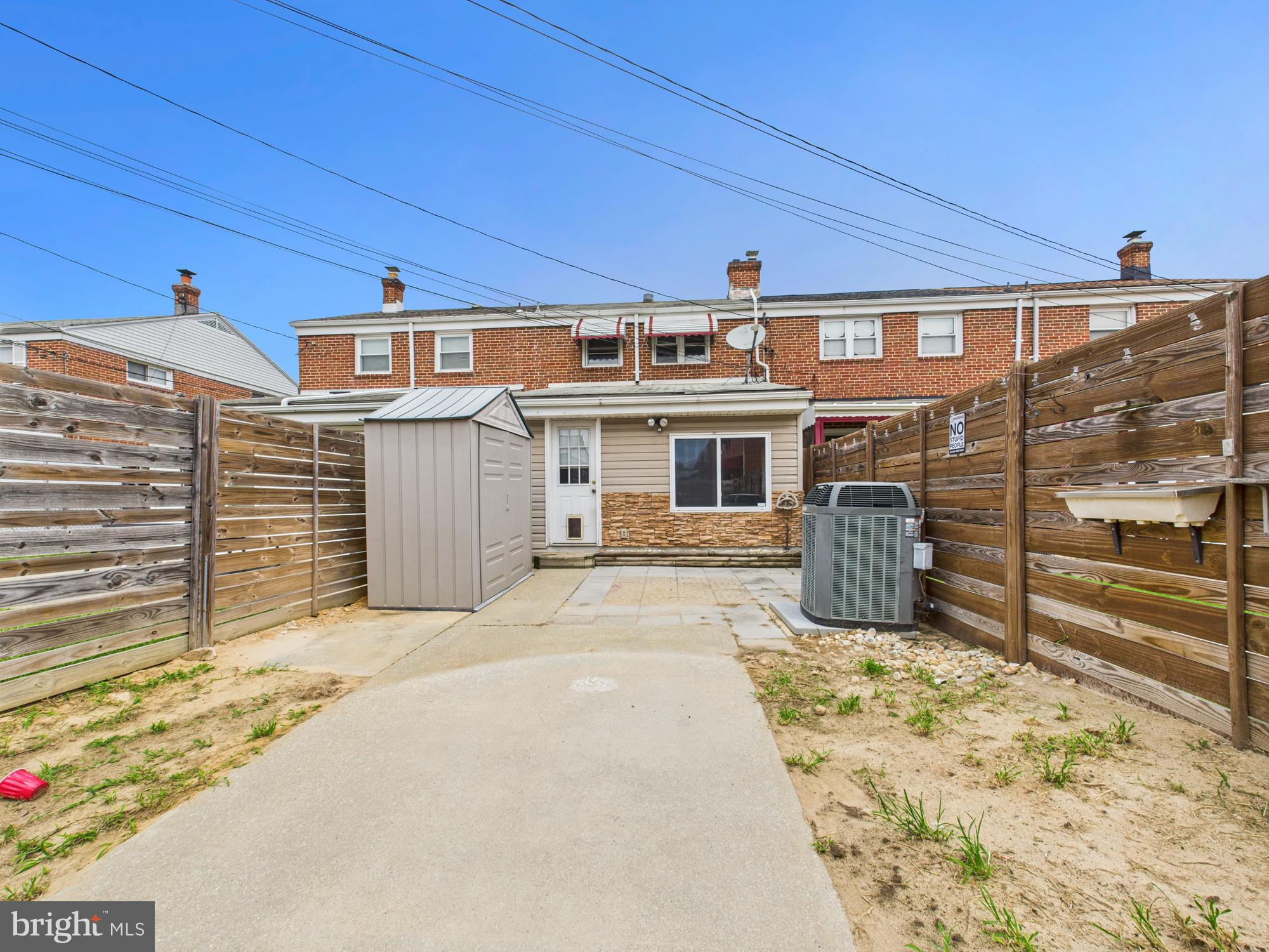 2743 Kirkleigh Road Dundalk, MD 21222 - Photo 24 of 31 a front view of a building with glass windows