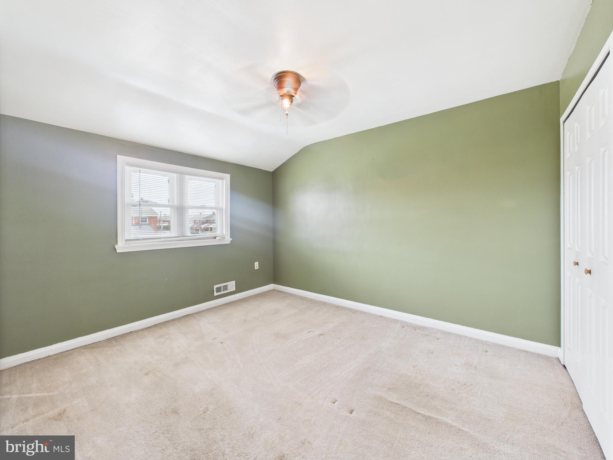 2743 Kirkleigh Road Dundalk, MD 21222 - Photo 7 of 31 a view of an empty room with a window